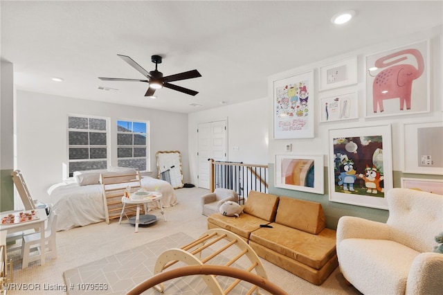 carpeted living room with visible vents, recessed lighting, and a ceiling fan