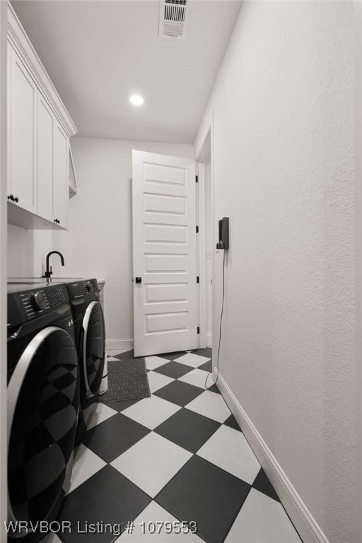 clothes washing area with tile patterned floors, visible vents, baseboards, and washer and clothes dryer