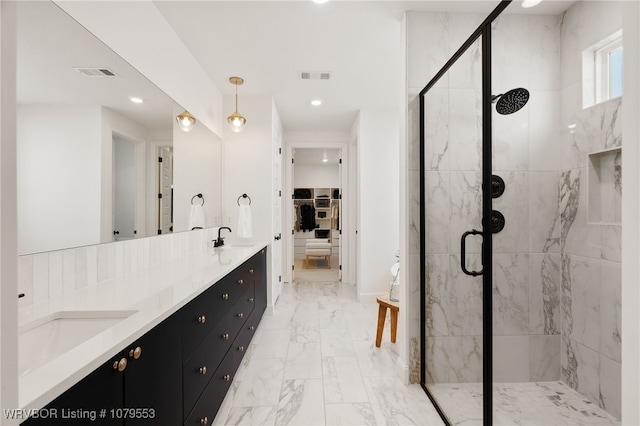 full bathroom with visible vents, a stall shower, and a sink