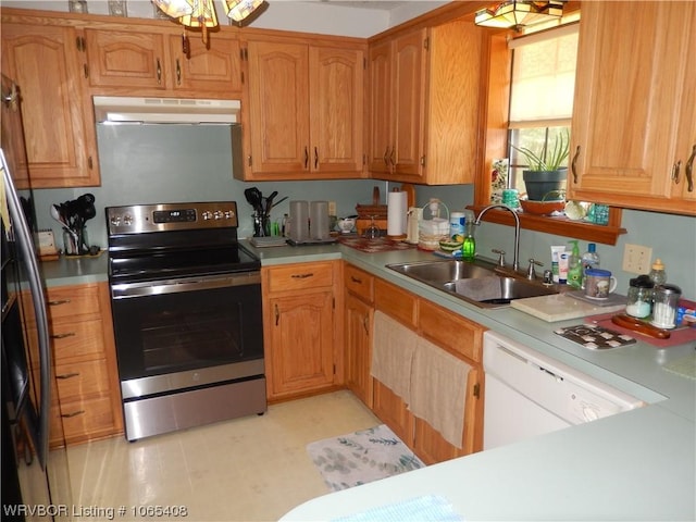 kitchen featuring white dishwasher, electric stove, sink, fridge, and extractor fan