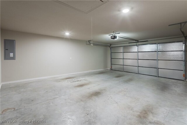 garage featuring electric panel and a garage door opener