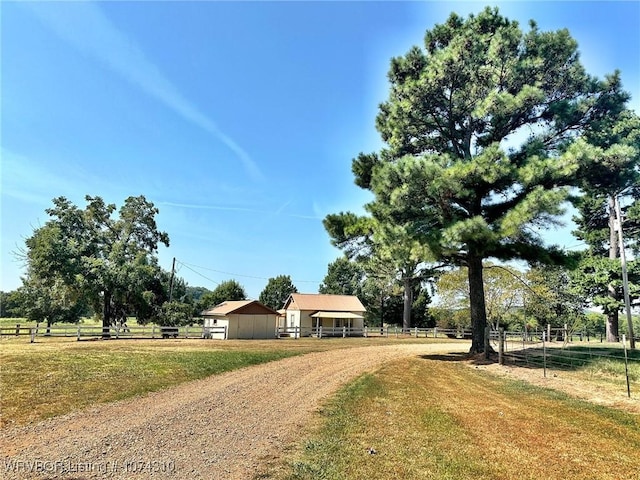 ranch-style home with a rural view