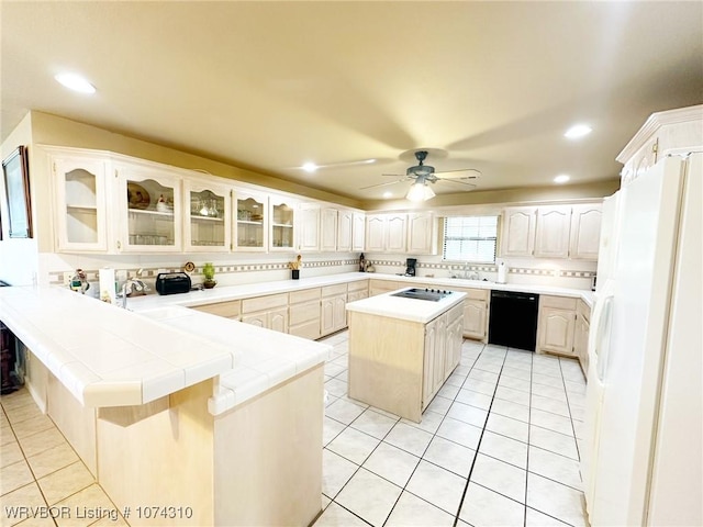 kitchen with kitchen peninsula, ceiling fan, white refrigerator with ice dispenser, dishwasher, and a kitchen island