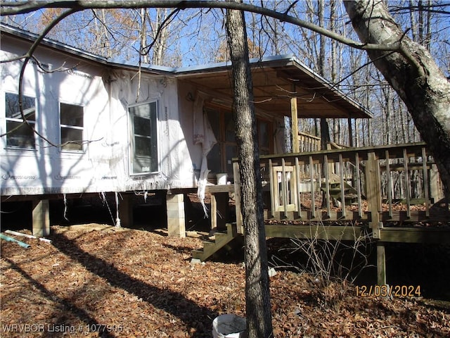 view of side of property with a wooden deck