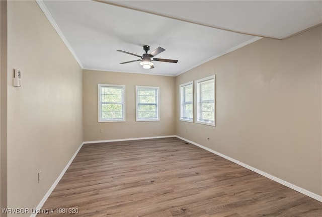 1501 S R St, Fort Smith, AR 72901 - spare room with plenty of natural light, crown molding, baseboards, and wood finished floors