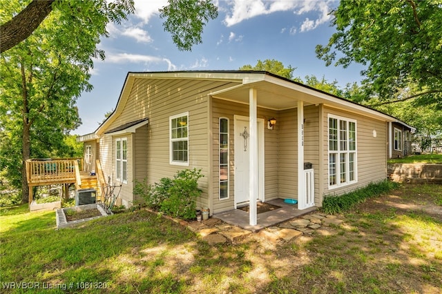 1501 S R St, Fort Smith, AR 72901 - back of house with a deck, central air condition unit, and a yard