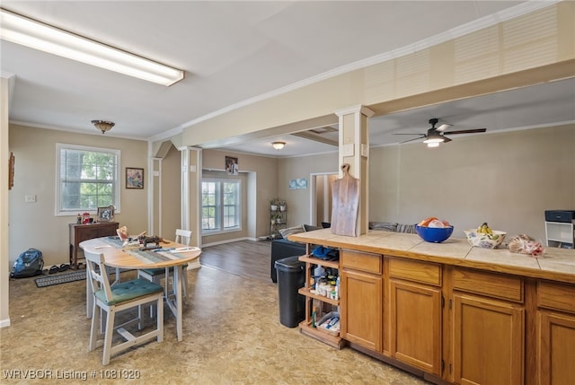 1501 S R St, Fort Smith, AR 72901 - kitchen with ornate columns, healthy amount of natural light, light flooring, open floor plan, and ornamental molding