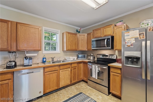 1501 S R St, Fort Smith, AR 72901 - kitchen with appliances with stainless steel finishes, a sink, ornamental molding, and tile countertops