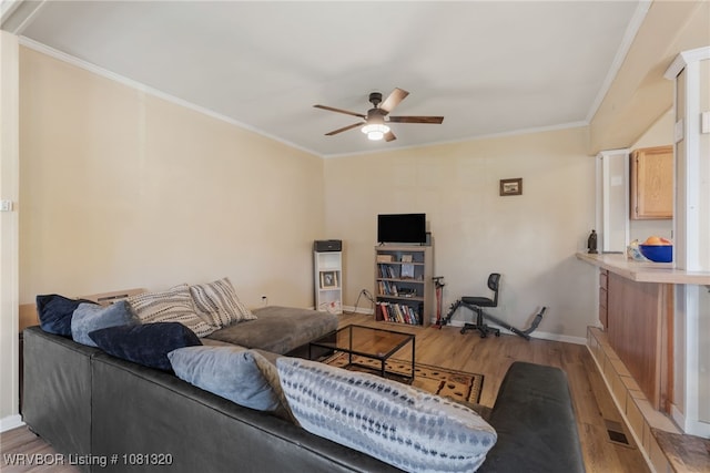 1501 S R St, Fort Smith, AR 72901 - living room featuring a ceiling fan, light wood-type flooring, crown molding, and baseboards