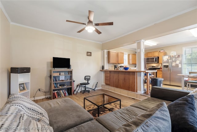 1501 S R St, Fort Smith, AR 72901 - living area with ceiling fan, light wood-style flooring, ornate columns, baseboards, and crown molding