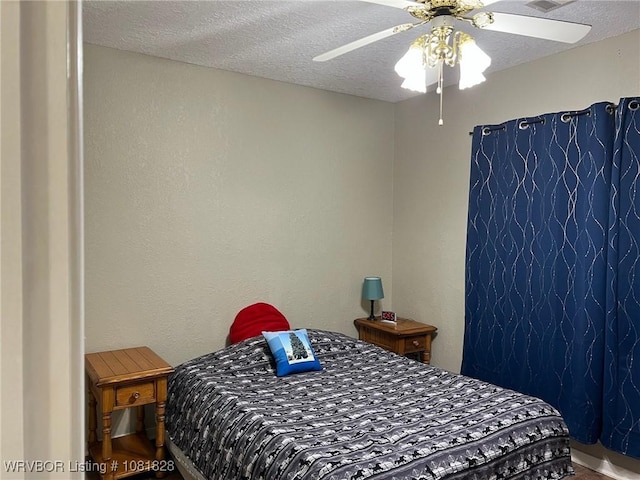 1610 Tiger Lily Ct, Greenwood, AR 72936 - bedroom featuring ceiling fan, a textured ceiling, and a textured wall