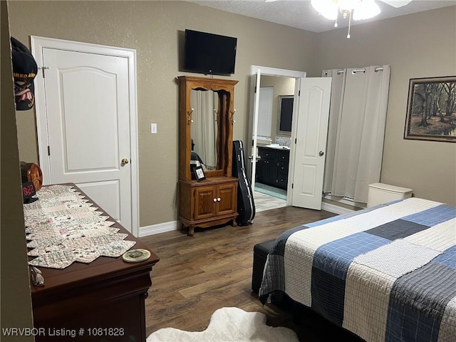 1610 Tiger Lily Ct, Greenwood, AR 72936 - bedroom with dark wood finished floors and connected bathroom