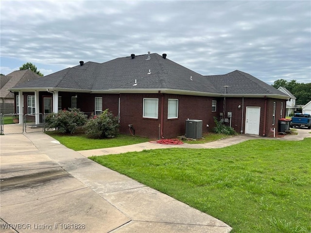 1610 Tiger Lily Ct, Greenwood, AR 72936 - back of property with a gate, a shingled roof, and brick siding
