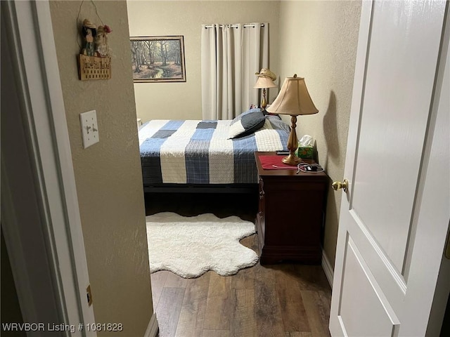 1610 Tiger Lily Ct, Greenwood, AR 72936 - bedroom with wood finished floors and a textured wall