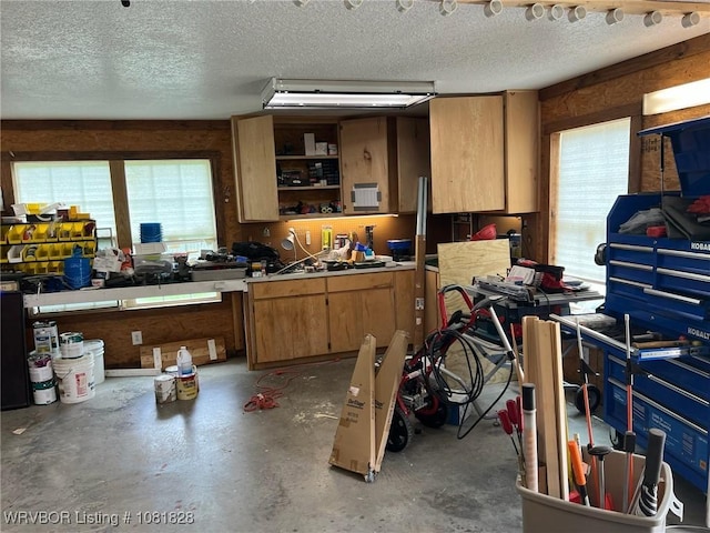 1610 Tiger Lily Ct, Greenwood, AR 72936 - kitchen featuring plenty of natural light, unfinished concrete floors, a textured ceiling, open shelves, and brown cabinetry