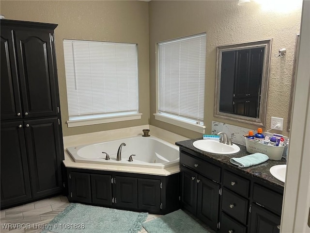 1610 Tiger Lily Ct, Greenwood, AR 72936 - full bath featuring double vanity, a garden tub, and a textured wall