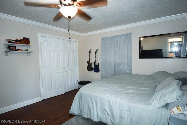 bedroom featuring ornamental molding, dark wood-type flooring, ceiling fan, and a textured ceiling