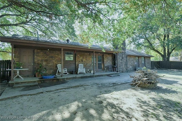 rear view of property with a patio area