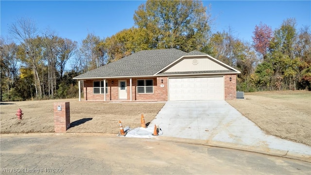 ranch-style house with covered porch and a garage