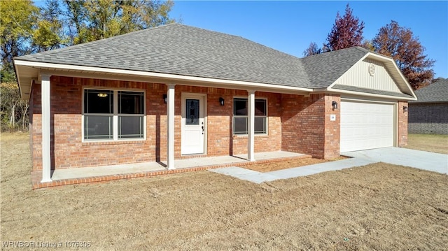 view of front of house with covered porch and a garage