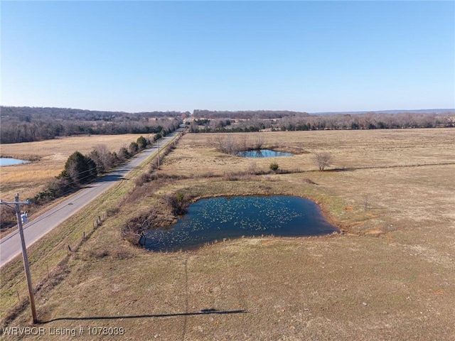 aerial view with a rural view and a water view