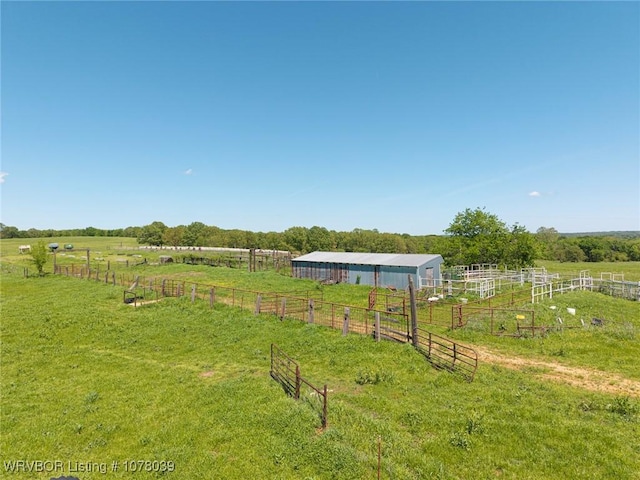 469517 E 1060th Rd, Muldrow, OK 74948 - view of yard featuring a pole building, fence, an outbuilding, and a rural view