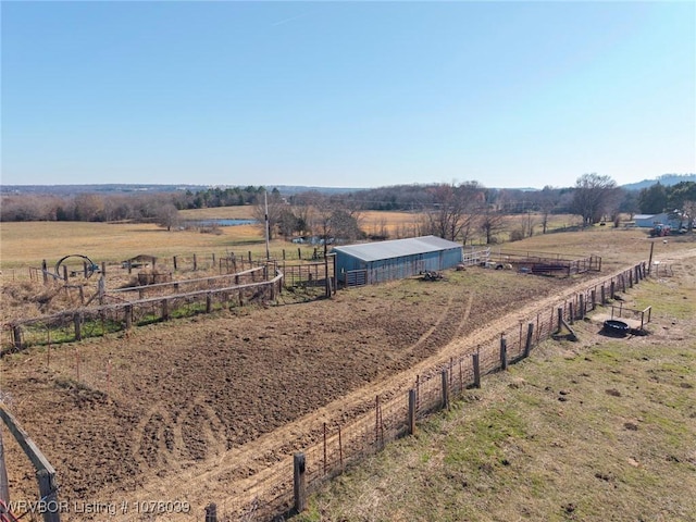 birds eye view of property featuring a rural view