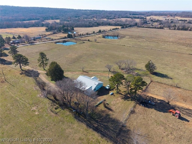 birds eye view of property with a rural view