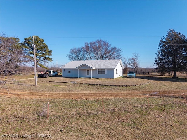 ranch-style house with a front lawn