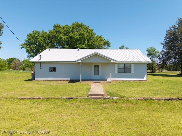 469517 E 1060th Rd, Muldrow, OK 74948 - back of house with a lawn and metal roof