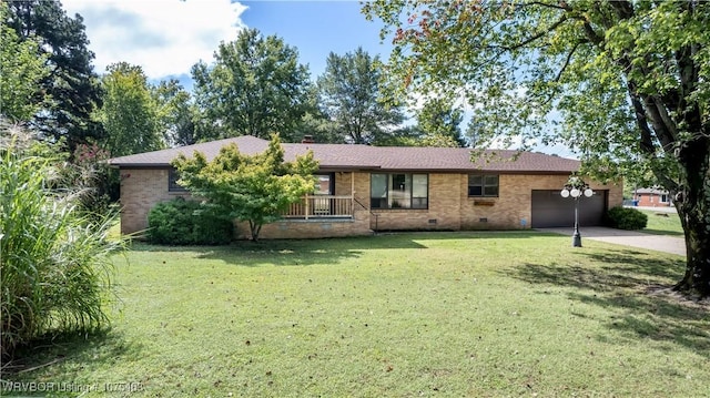 ranch-style home with a garage and a front yard