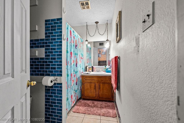 5914 Asa Craig Rd, Greenwood, AR 72936 - full bath featuring vanity, tile patterned flooring, a textured ceiling, a shower with curtain, and visible vents
