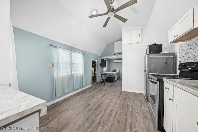 5914 Asa Craig Rd, Greenwood, AR 72936 - kitchen featuring ceiling fan, light wood finished floors, electric stove, and lofted ceiling
