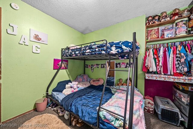 5914 Asa Craig Rd, Greenwood, AR 72936 - carpeted bedroom featuring baseboards and a textured ceiling