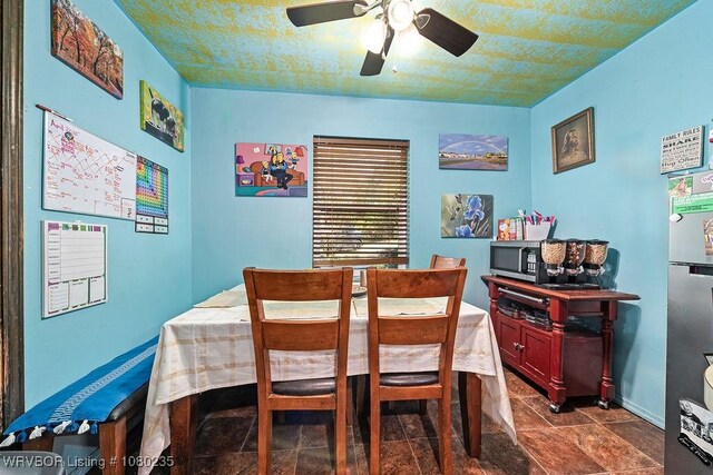 5914 Asa Craig Rd, Greenwood, AR 72936 - dining room featuring baseboards, a ceiling fan, and stone finish flooring