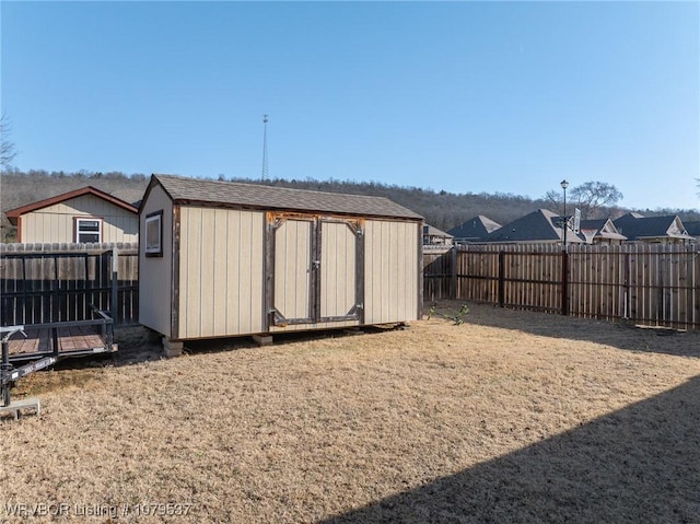 view of shed featuring a fenced backyard