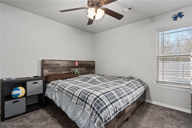 bedroom with visible vents, carpet floors, baseboards, and ceiling fan