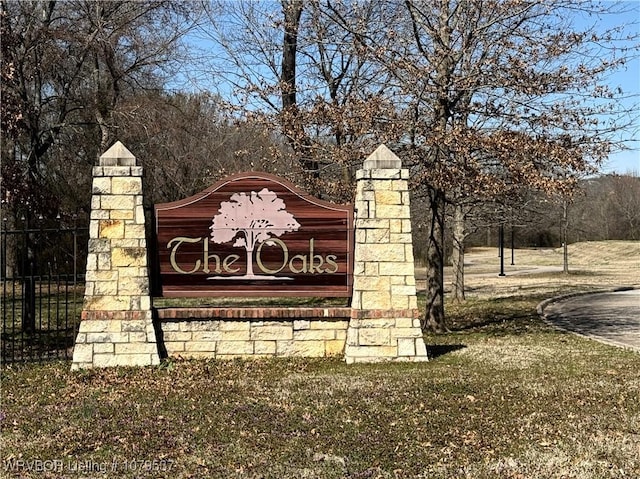 community sign featuring fence