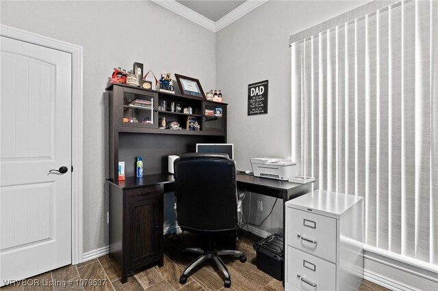 office with baseboards, wood finished floors, and crown molding