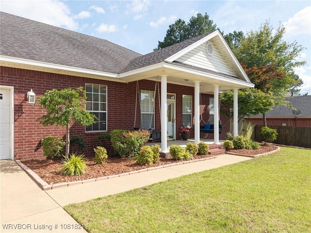 1318 Taos Dr, Van Buren, AR 72956 - entrance to property featuring brick siding, a shingled roof, and a porch