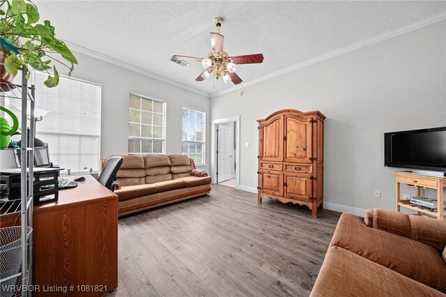 1318 Taos Dr, Van Buren, AR 72956 - living area with ceiling fan, wood finished floors, ornamental molding, and a textured ceiling