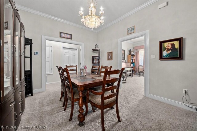 1318 Taos Dr, Van Buren, AR 72956 - dining room with light carpet, crown molding, and a chandelier