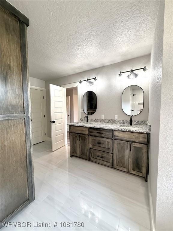 2948 N Hwy 282, Van Buren, AR 72956 - bathroom featuring double vanity and a textured ceiling