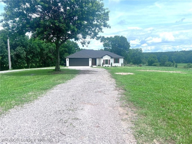 2948 N Hwy 282, Van Buren, AR 72956 - single story home featuring gravel driveway, a front yard, and a garage