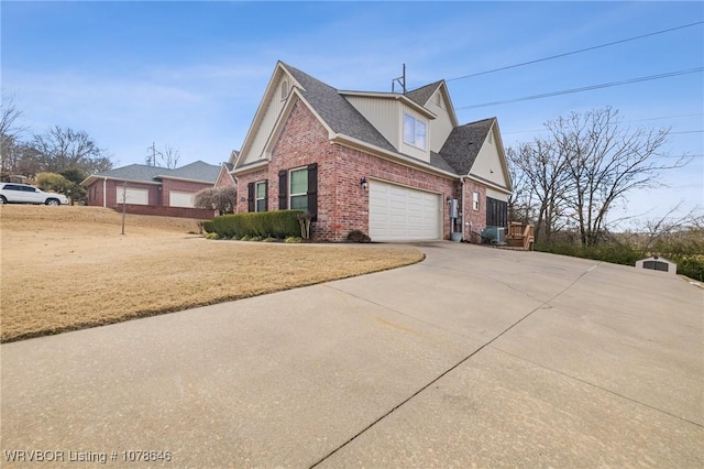 view of home's exterior featuring a garage and a yard