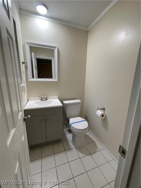 123 Gamma Cir, Roland, OK 74954 - bathroom with ornamental molding, vanity, and tile patterned flooring