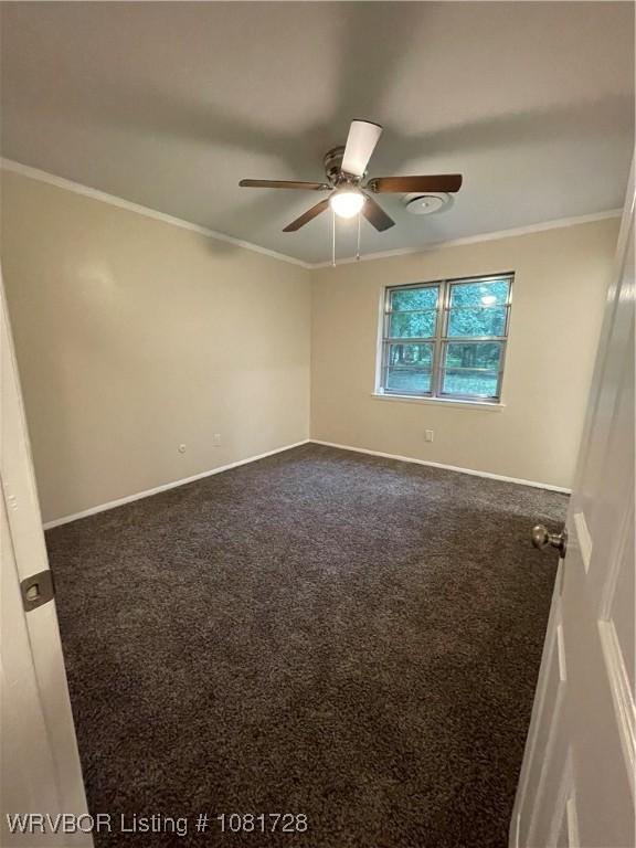 123 Gamma Cir, Roland, OK 74954 - spare room with ceiling fan, crown molding, and carpet flooring