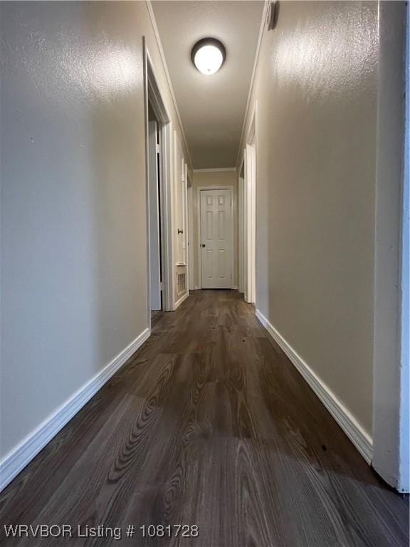 123 Gamma Cir, Roland, OK 74954 - hall with dark wood finished floors and ornamental molding