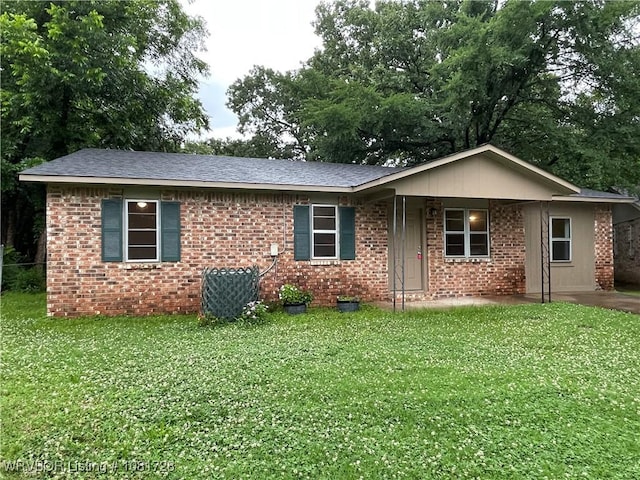 123 Gamma Cir, Roland, OK 74954 - ranch-style house featuring a front lawn, a shingled roof, and brick siding
