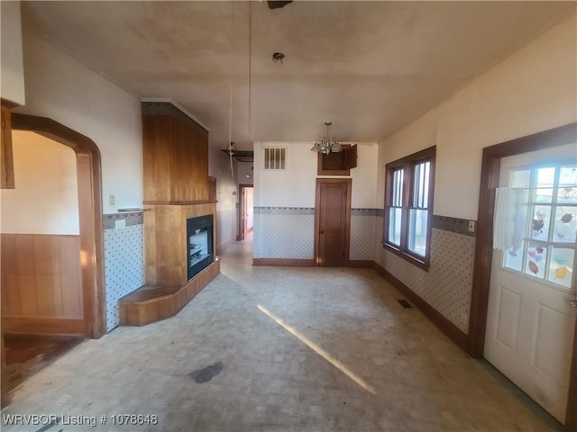 unfurnished living room with a fireplace